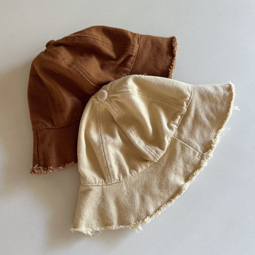 Kids neutral bucket hat with frayed edge detail