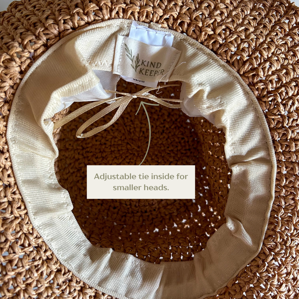 Neutral kids straw hat available in light and dark tones, perfect for year-round wear