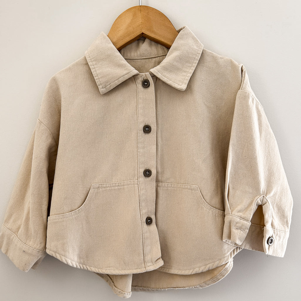 Toddler cream cotton shirt with full button front and relaxed fit